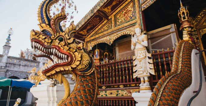 close-up view of statue of dragon near ancient temple in Chiang Mai, Thailand